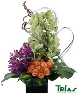 white orchids purple orchids with orange roses in vase