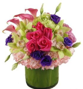 red roses with other pink and purple flowers in vase