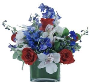 beautiful arrangement of red, white, & blue flowers.